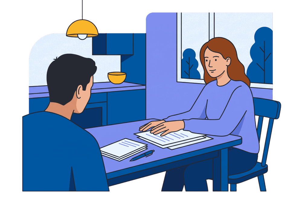 Two family members going through paperwork at a kitchen table